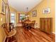 Bright dining area featuring a round table, wood floors, and lots of natural light at 1653 Albino St, Nokomis, FL 34275