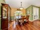 Dining room features decorative lighting, a china cabinet, and French doors to the lanai at 1653 Albino St, Nokomis, FL 34275
