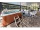 Relaxing hot tub nestled on the paved patio under the screened enclosure at 1653 Albino St, Nokomis, FL 34275
