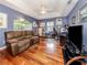 Home office with built in bookcases and a comfortable sofa with plenty of space to work and relax at 1653 Albino St, Nokomis, FL 34275