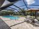 Pool and patio with a screened enclosure provide the perfect space for outdoor gatherings and relaxation at 1653 Albino St, Nokomis, FL 34275