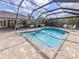 Sparkling pool surrounded by a paved patio within a screened enclosure for year-round enjoyment at 1653 Albino St, Nokomis, FL 34275
