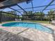 Beautiful pool within a screened enclosure, offering a private and relaxing outdoor oasis at 1653 Albino St, Nokomis, FL 34275