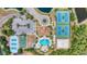 An aerial view of community amenities, including tennis courts, basketball court, pool, and clubhouse at 2094 Mesic Hammock Way, Venice, FL 34292