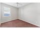 Bedroom with carpet and ceiling fan, and a window at 2094 Mesic Hammock Way, Venice, FL 34292