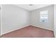 Bedroom with carpet, ceiling fan, and a window at 2094 Mesic Hammock Way, Venice, FL 34292