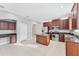 Bright kitchen with island, stainless steel appliances, and ample counter space at 2094 Mesic Hammock Way, Venice, FL 34292