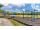 Community playground with climbing structure and other play equipment for recreation and enjoyment at 2094 Mesic Hammock Way, Venice, FL 34292