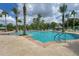 Resort-style pool surrounded by palm trees and lounge chairs offers a relaxing vacation atmosphere at 2094 Mesic Hammock Way, Venice, FL 34292