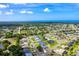 Wide aerial shot of a lovely neighborhood, highlighting the lush surroundings at 23 Tiffany St, Englewood, FL 34223