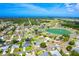 Residential area, showcasing a home near a scenic pond and lush greenery at 23 Tiffany St, Englewood, FL 34223