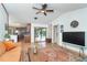 Spacious living area featuring hardwood floors, an area rug, and an open layout at 23 Tiffany St, Englewood, FL 34223