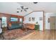 Comfortable living room with hardwood floors, paneled walls, and modern furnishings at 23 Tiffany St, Englewood, FL 34223