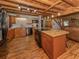 Kitchen featuring tile backsplash, stainless steel appliances, wood floors, and wood ceiling at 2450 Flagami Ln, North Port, FL 34286
