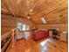 Loft with wood walls and ceiling, wood floors, multiple windows, and a skylight at 2450 Flagami Ln, North Port, FL 34286