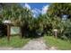 Picturesque river access featuring lush vegetation and a convenient boat launch at 2450 Flagami Ln, North Port, FL 34286