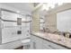 Updated bathroom featuring granite counters and a walk-in shower with designer tile accents at 250 Santa Maria St # 216, Venice, FL 34285