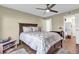 Bedroom with wood floors and view to laundry area at 250 Santa Maria St # 216, Venice, FL 34285