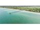 Extensive aerial perspective of the Venice Fishing Pier stretching into the calm, turquoise sea at 250 Santa Maria St # 216, Venice, FL 34285