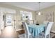 Bright dining room with pendant lighting and a pass-through to a modern kitchen at 250 Santa Maria St # 216, Venice, FL 34285