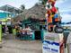 Outdoor tiki bar with thatched roof and patrons enjoying the casual atmosphere at 250 Santa Maria St # 216, Venice, FL 34285