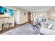Open-concept living room connected to a dining area and kitchen with views and comfortable seating at 250 Santa Maria St # 216, Venice, FL 34285