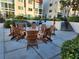 Outdoor patio area with chairs for entertaining at 250 Santa Maria St # 216, Venice, FL 34285