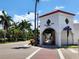 Charming street view with mature palm trees and quaint shops along the avenue in a desirable community at 250 Santa Maria St # 216, Venice, FL 34285