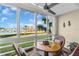Bright sunroom with large windows overlooking the boats, providing natural light and serene views at 250 Santa Maria St # 216, Venice, FL 34285