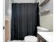 Bathroom featuring a shower curtain, shelves, toilet, and vanity at 4068 Palau Dr, Sarasota, FL 34241