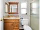 A clean bathroom features a granite countertop, wood cabinet, and a shower with glass doors at 4068 Palau Dr, Sarasota, FL 34241