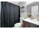 Bathroom featuring a shower curtain, shelves, toilet, and vanity at 4068 Palau Dr, Sarasota, FL 34241