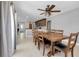 Bright dining room features a wooden table with seating for eight and an open view to the kitchen at 4068 Palau Dr, Sarasota, FL 34241