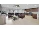 Open-concept living and kitchen area with tile floors and stainless steel appliances at 4068 Palau Dr, Sarasota, FL 34241