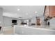 Open concept living room with granite countertops, stainless sink, and view to the adjacent Gathering room at 4068 Palau Dr, Sarasota, FL 34241