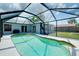 A beautiful screened-in pool offers a refreshing escape, with a large deck and seating area for relaxing and entertaining at 4068 Palau Dr, Sarasota, FL 34241