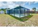 Backyard view of the screened pool, offering a private retreat with easy access to the home and outdoor activities at 4068 Palau Dr, Sarasota, FL 34241