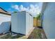 A practical storage shed provides ample space for gardening tools and equipment, ensuring a clutter-free yard at 4068 Palau Dr, Sarasota, FL 34241