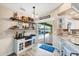 Entertainers bar area features a beverage fridge, wine rack, and easy access to the outdoor pool at 4305 Sandune Ave, North Port, FL 34287