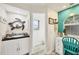 Bathroom featuring an unique turtle mirror, tiled floor, and a vanity area at 4305 Sandune Ave, North Port, FL 34287