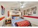 Themed bedroom with baseball decor, a ceiling fan, and cozy furnishings at 4305 Sandune Ave, North Port, FL 34287