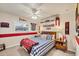 Decorated bedroom with baseball accents, a ceiling fan, and ample wall decorations at 4305 Sandune Ave, North Port, FL 34287