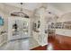 Bright foyer leads to a dining room with hardwood floors and elegant wainscoting at 4305 Sandune Ave, North Port, FL 34287