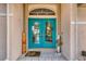 Close-up of the inviting double front doors featuring a 