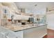 Bright kitchen with granite countertops, stainless steel appliances, and an island with wood countertop at 4305 Sandune Ave, North Port, FL 34287