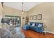 Comfortable living room with a view of the screened-in lanai and pool area at 4305 Sandune Ave, North Port, FL 34287