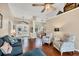 Open concept living room showcasing vaulted ceilings, tile entry, and a view into the bright dining area at 4305 Sandune Ave, North Port, FL 34287