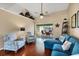 Cozy living room with vaulted ceilings, comfortable seating, and access to the screened lanai at 4305 Sandune Ave, North Port, FL 34287