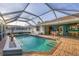 View of pool area featuring an enclosed patio with an outdoor bar at 4305 Sandune Ave, North Port, FL 34287