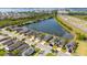 An aerial view of charming single-Gathering homes along a tranquil pond, close to the highway at 4835 San Ortebello Dr, Bradenton, FL 34208